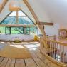 Color barn, © Reichlin Interior view of an attic with wooden floor, large windows and works of art on the walls.