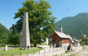 Meeting hammer, © Gemeinde Hollenstein Historic building with chimney and water wheel in a rural setting.
