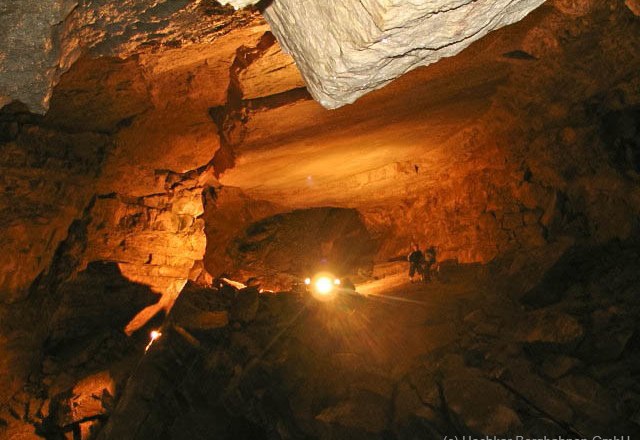 Interior view of the Hochkar cave with illuminated rock formations.