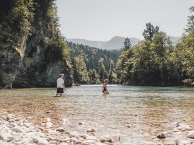 Couple wading in the river along the Ybbstal cycle path
