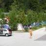 Campsite with tents and people in the open air.